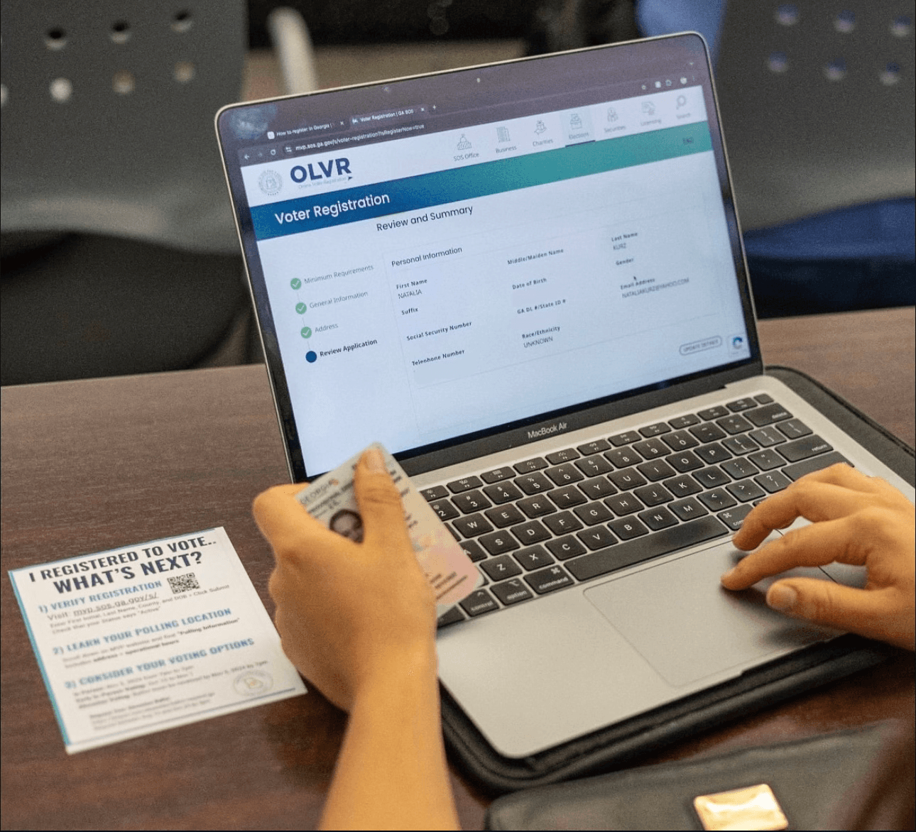 USHSVP volunteers assisting students with voter registration forms.